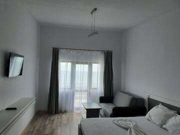 Фото номера Семейный номер с балконом Проживание в семье Premium Sea View *** г. Костинешти 3